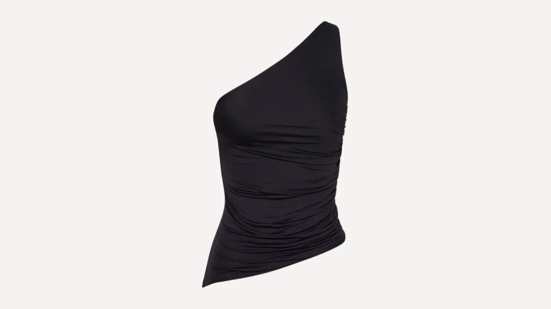 black one-shoulder top with an asymmetrical neckline and a ruched bodice for a flattering fitted look on white backround