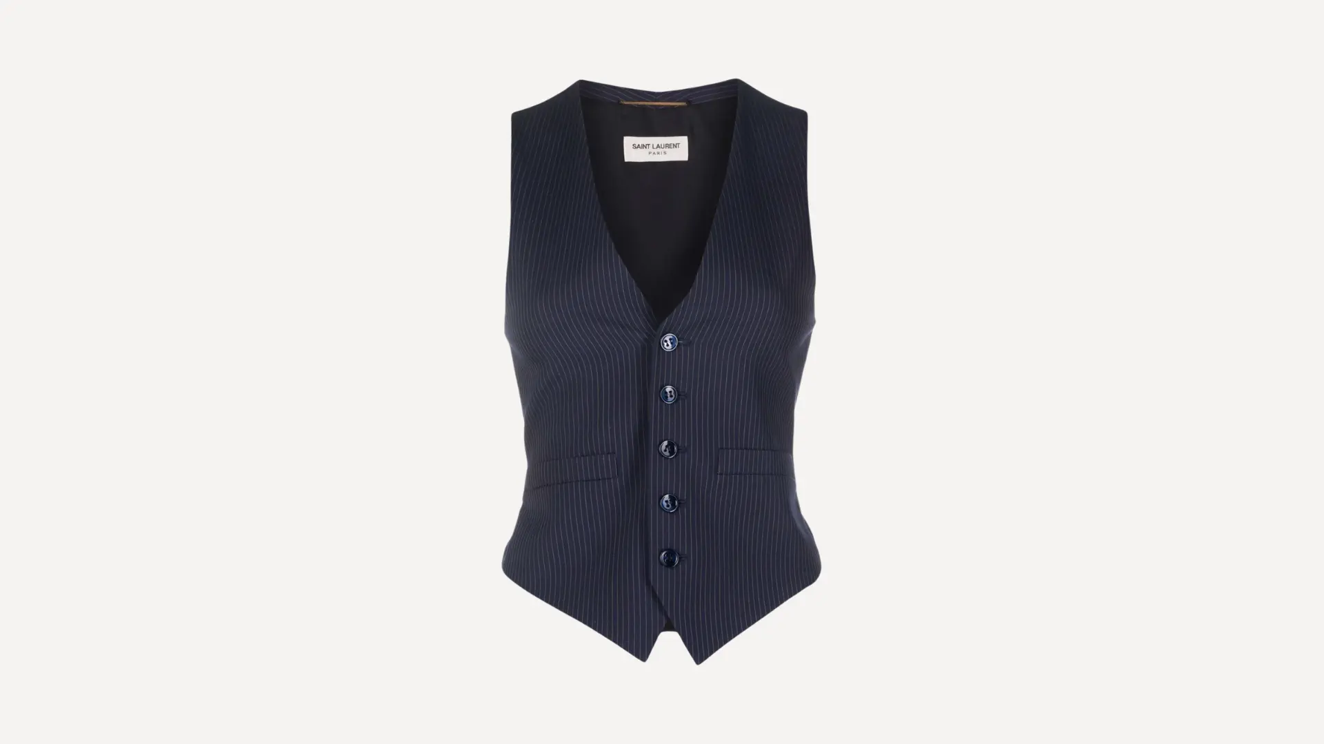 blue sleeveless waistcoat top with a high neckline and an asymmetrical pleated hem on a plain background