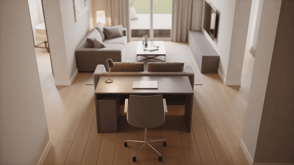 compact desk placed behind sofa creating a clear work zone in open living room layout.