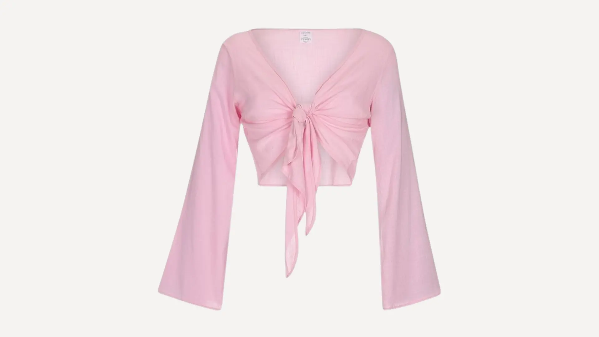 light pink long-sleeve tie-front top with a deep v-neckline and wide flared sleeves on a plain white background