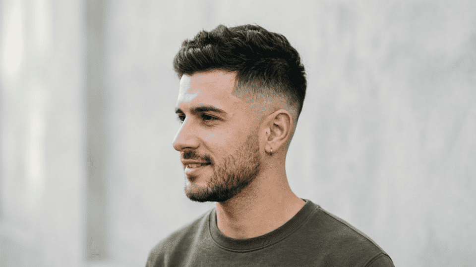 mens taper haircut with gradual natural blend from longer hair to short neckline