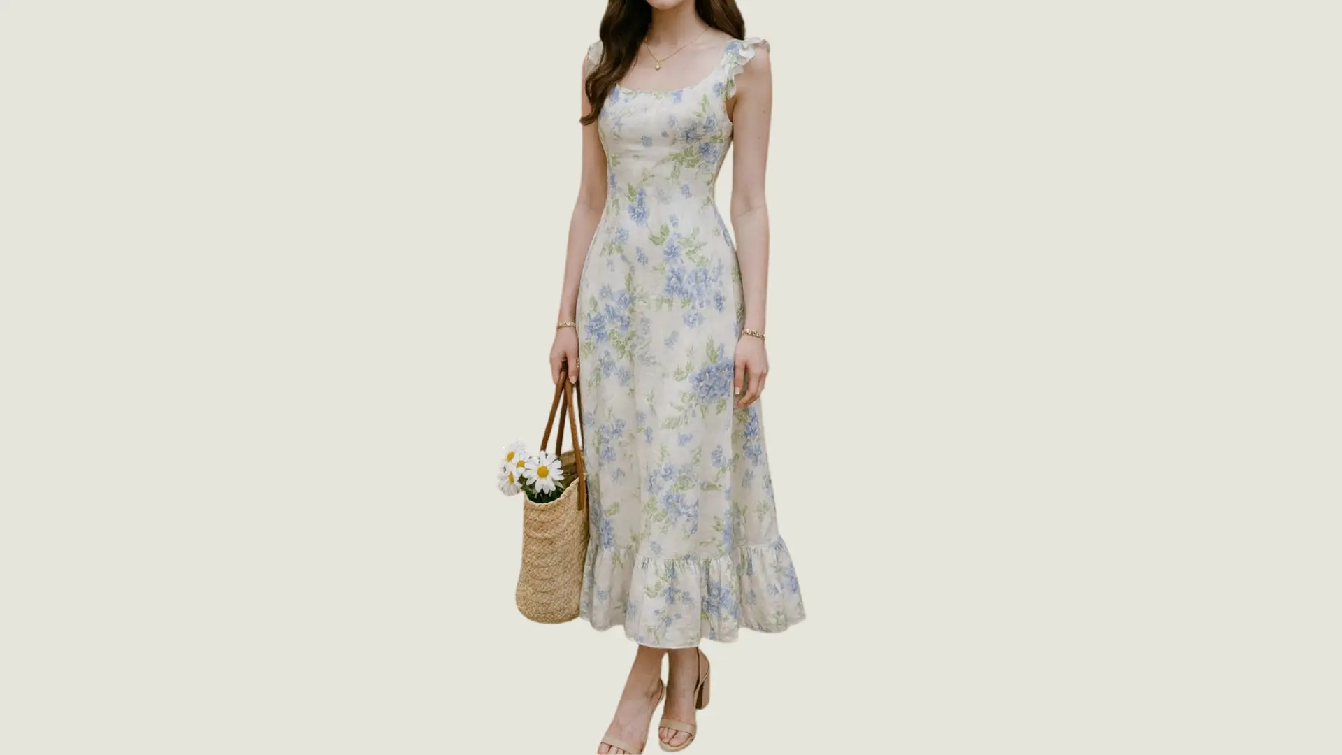woman in a romantic style wearing a floral midi dress with ruffles and holding a straw bag with daisies
