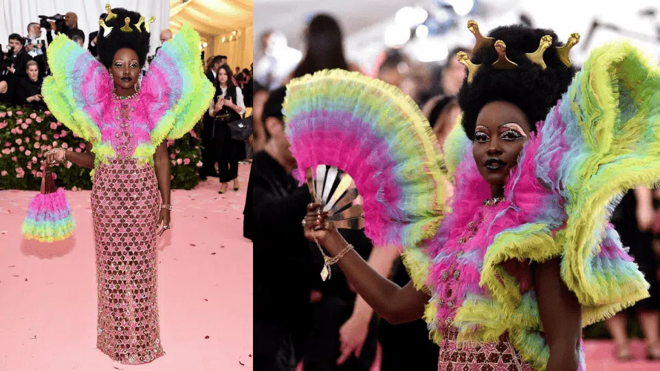 lupita nyongo in rainbow atelier versace gown with sculptural shoulders at the 2019 met gala camp notes on fashion theme