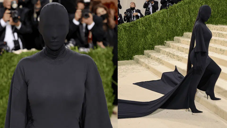 kim kardashian in head to toe black balenciaga with full face mask at the 2021 met gala in america a lexicon of fashion theme