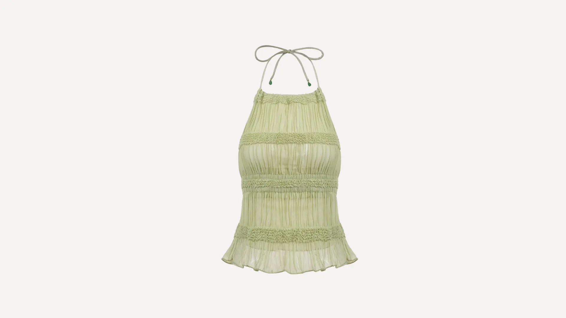 light green halter smocked top with tiered ruffles, a flowy hem, and thin neck ties on a plain white background