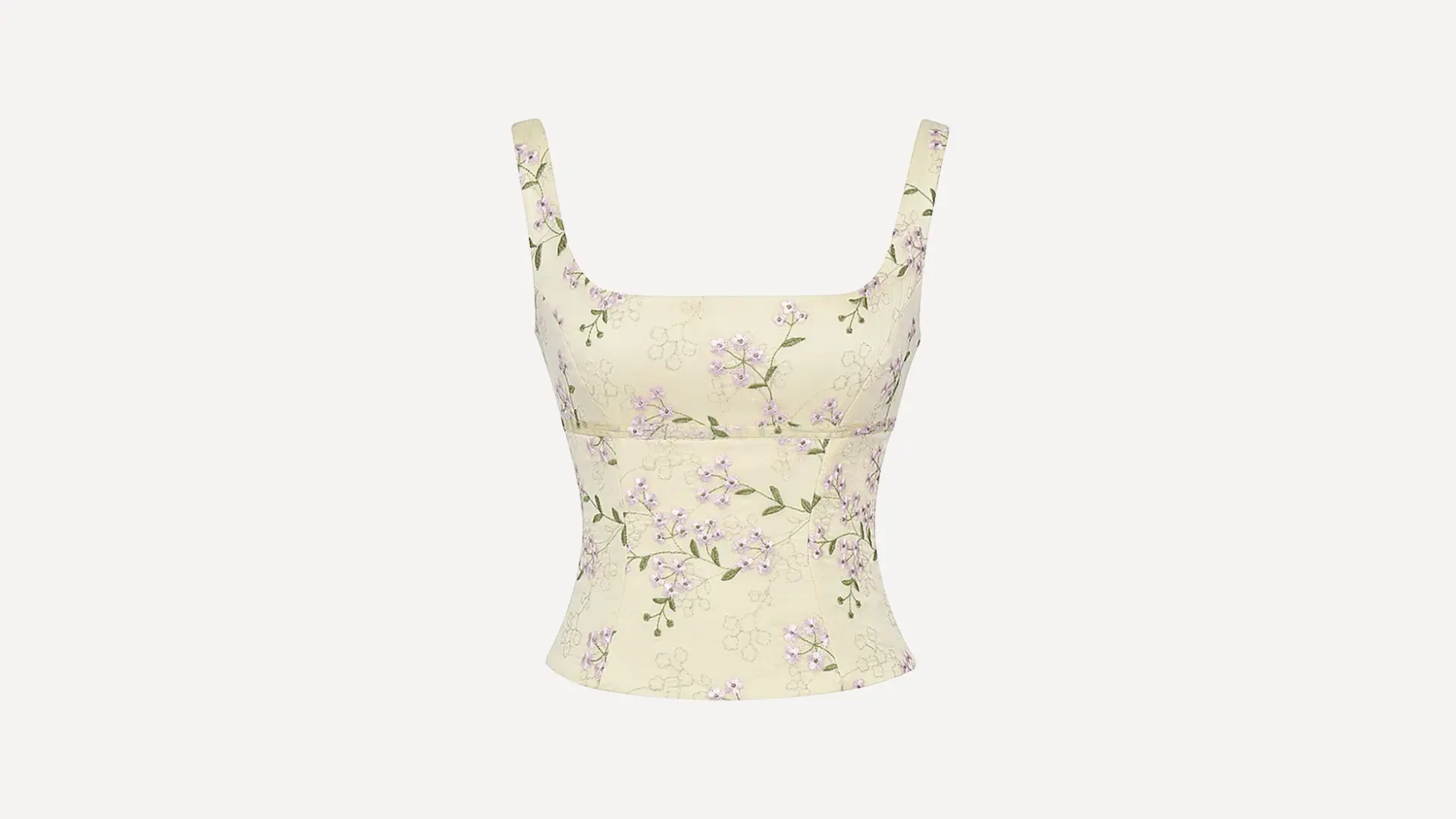 pale yellow princess line top with delicate purple floral embroidery and a square neckline on a white background