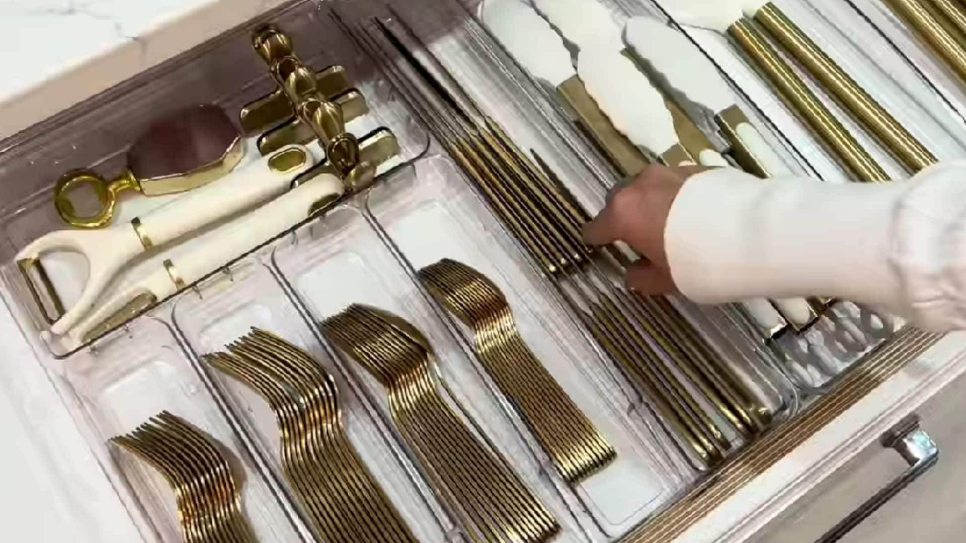 Organizing kitchen tools by function with dividers to keep frequently used items within easy reach