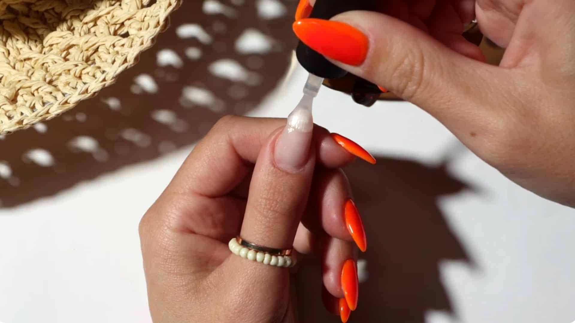 prepare nails by applying a thin base coat, ensuring adhesion and sealing edges for durability