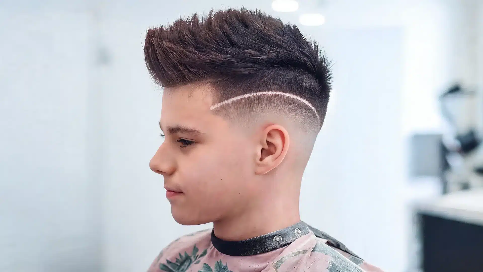 boys haircut with design featuring a simple side line fade for a clean first haircut idea