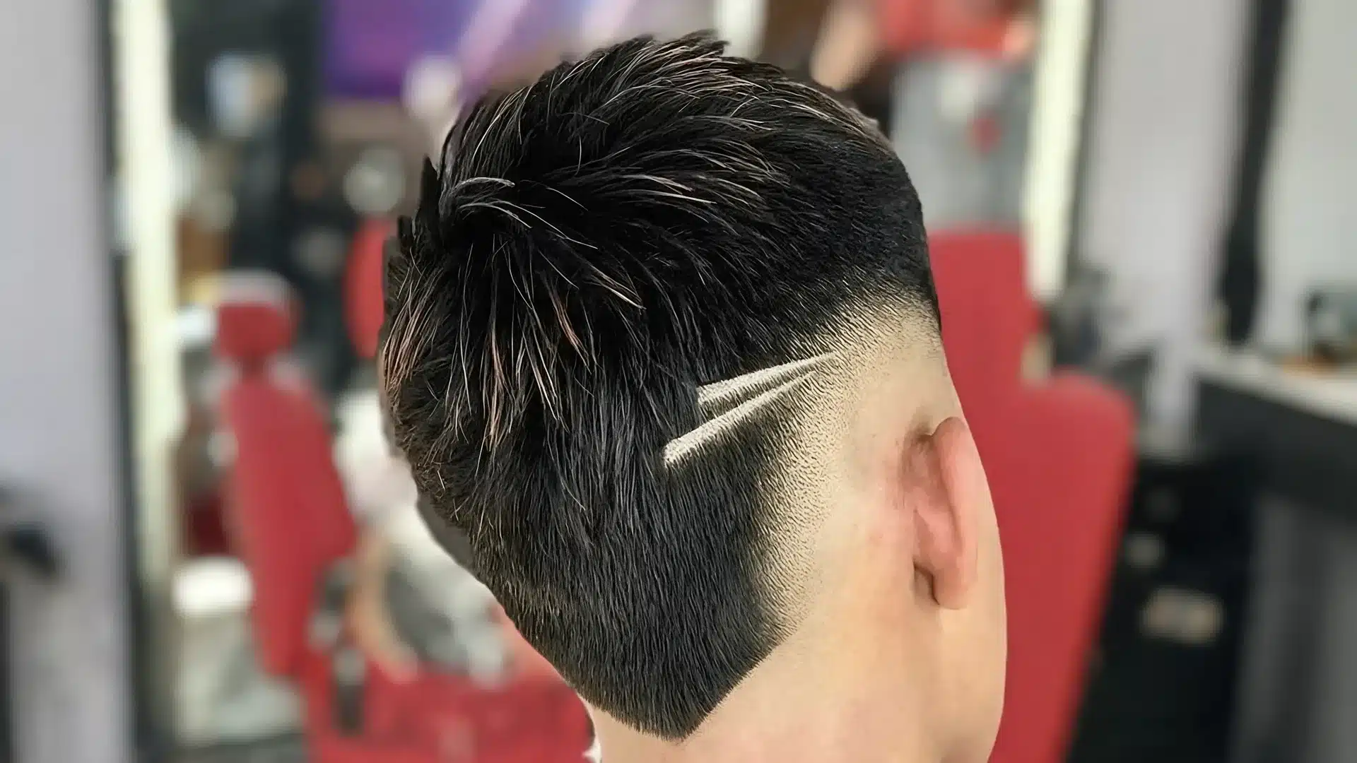 boys haircut with design showing two clean side lines in a neat faded haircut for kids