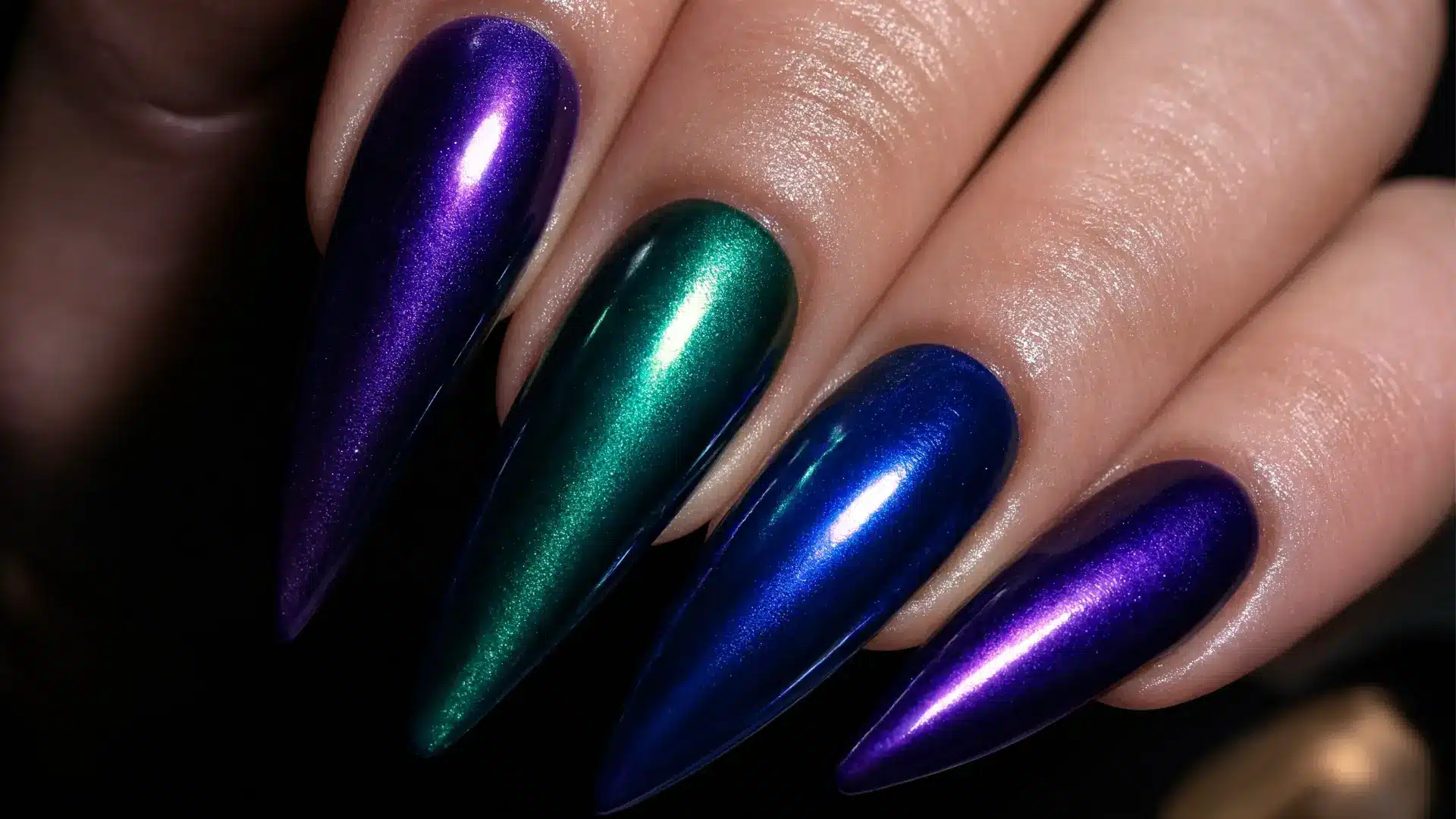 close up cat eye magnetic gel nails almond stiletto shapes glowing shifting light line reflective jewel tone finish soft