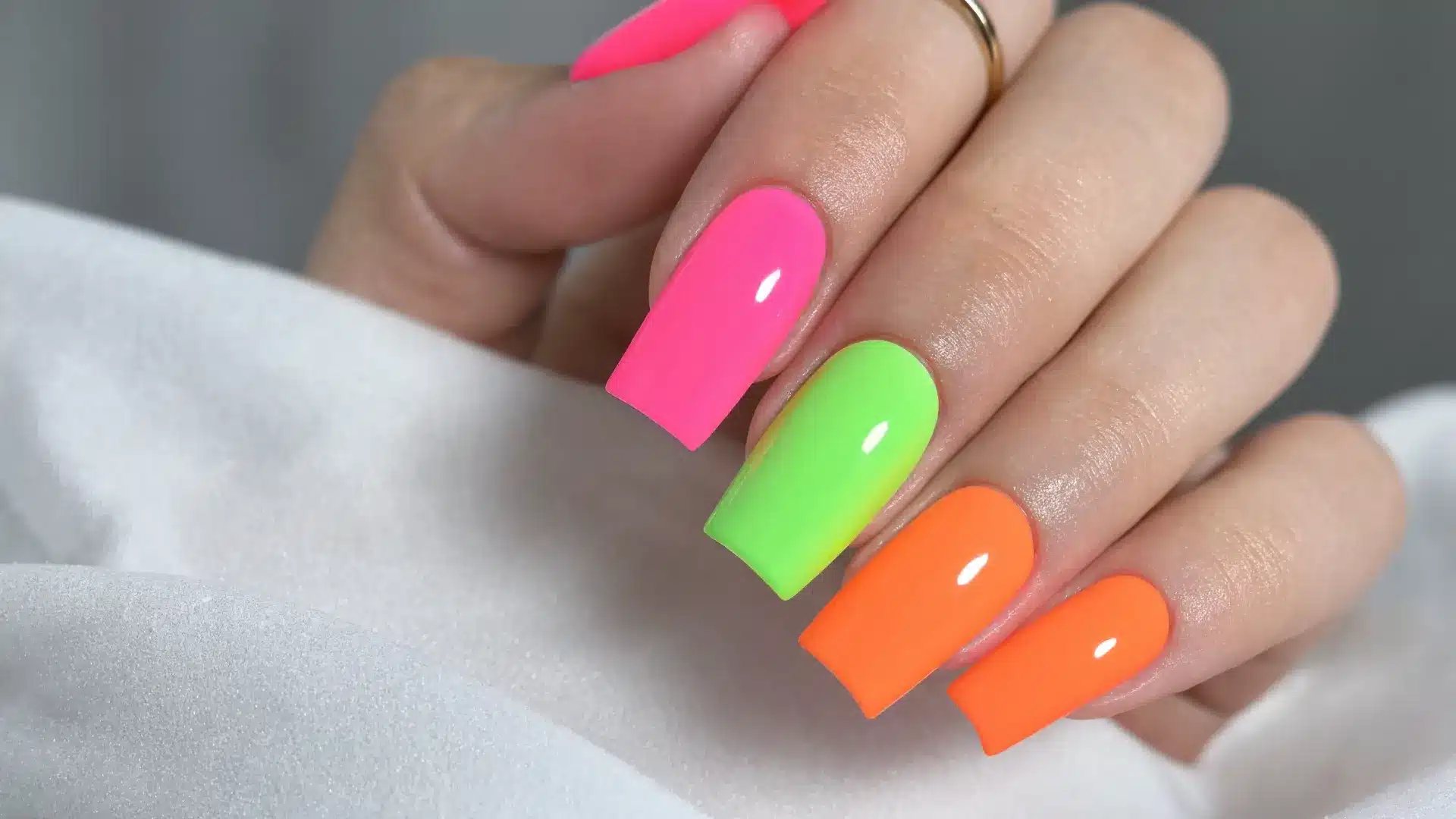 close up neon nails coffin stiletto square bright electric colors acrylic gel finish summer festival fashion look