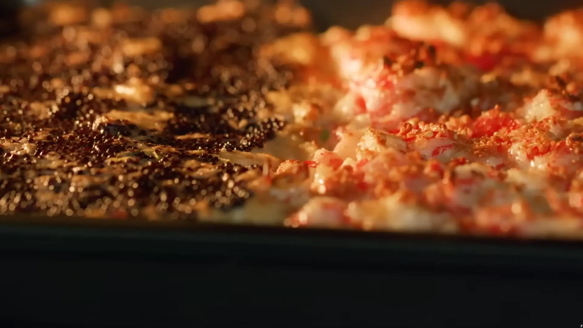dish in oven turning golden and bubbly as creamy topping cooks and slightly crisps