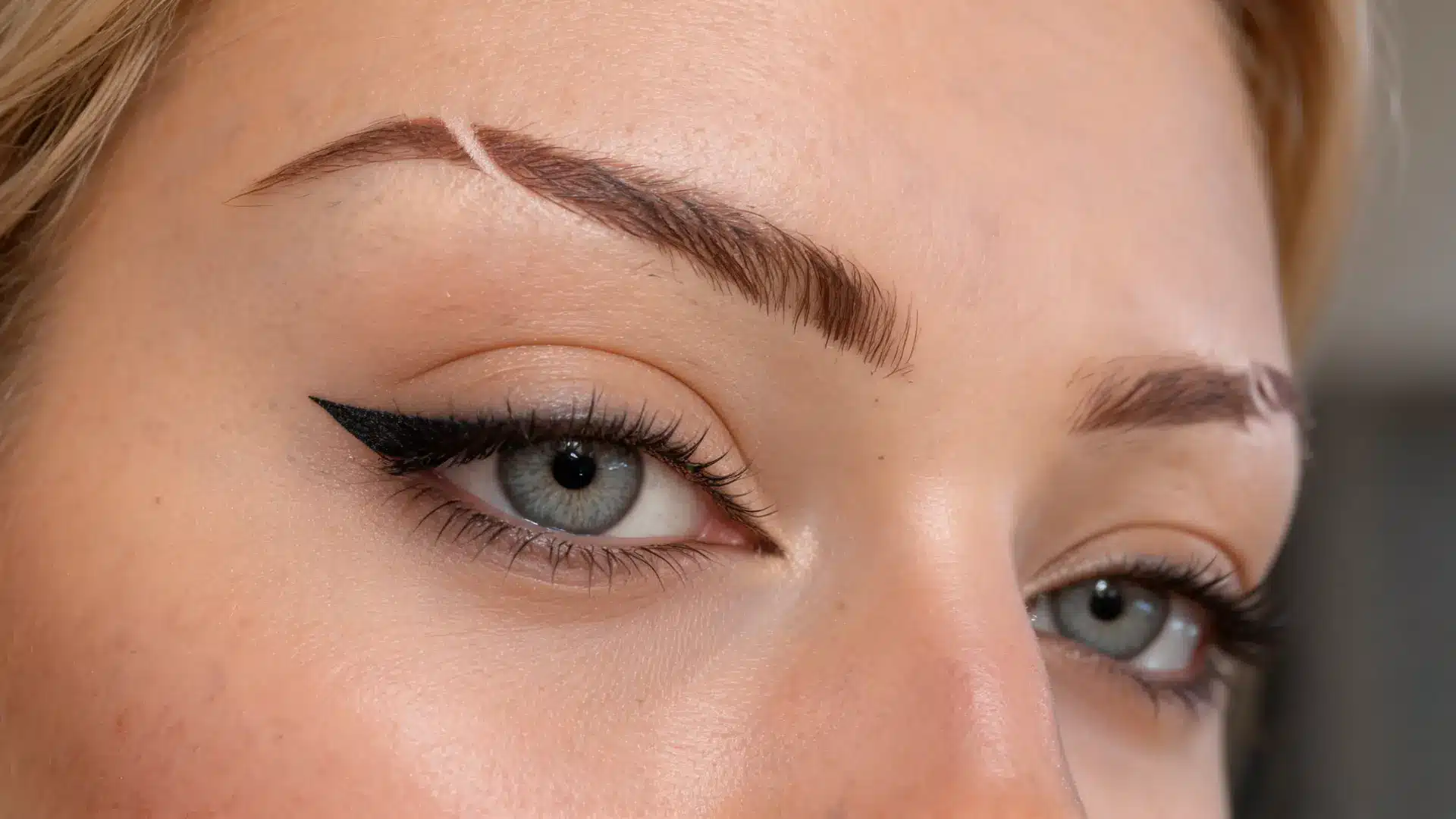 half eyebrow slit with partial cut in brow creating subtle stylish detail with soft controlled natural look and easy grow out effect (1)