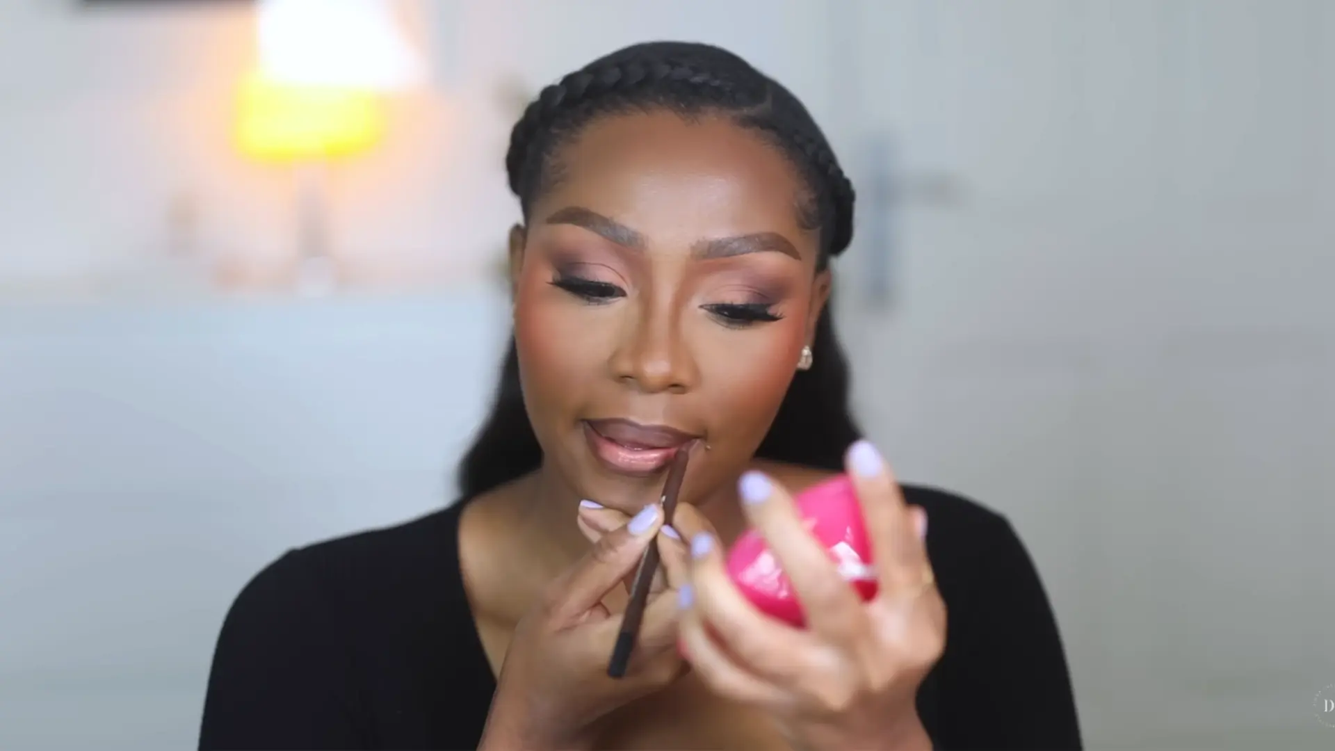 lip makeup step for soft glam makeup looks with brown lip liner, nude lipstick, and glossy finish