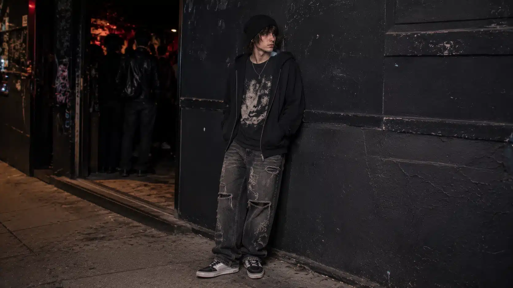 y2k men outfits with pop punk tee zip hoodie distressed jeans and skate shoes for concerts