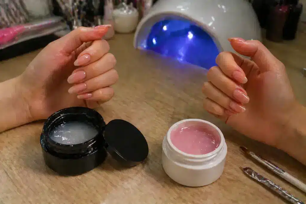 Nail salon scene featuring Hard Gel and Builder Gel jars