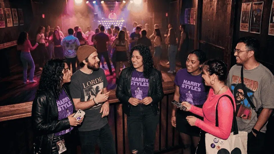 a group of fans talking about interesting topic and pop culture in a celebratory gathering.
