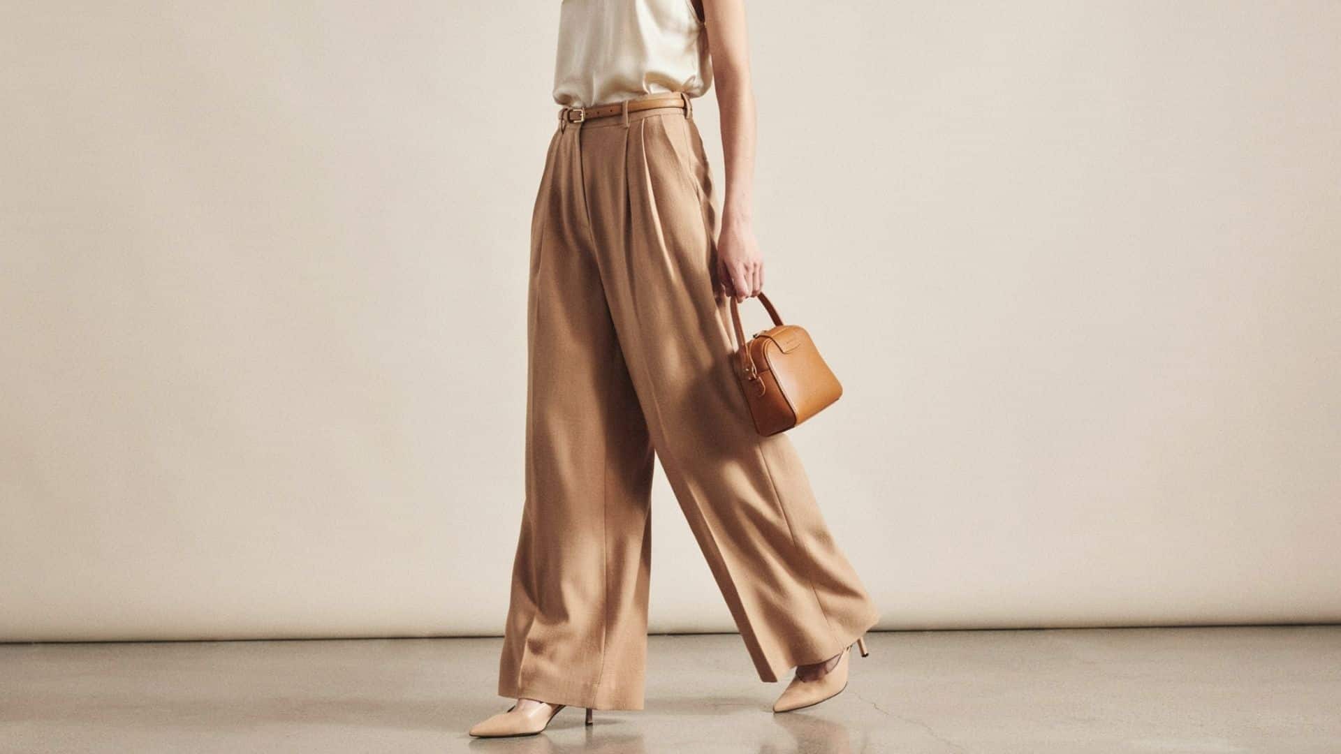 Person wearing stylish wide-leg trousers with a relaxed fit and modern outfit showcasing a comfortable fashion look.