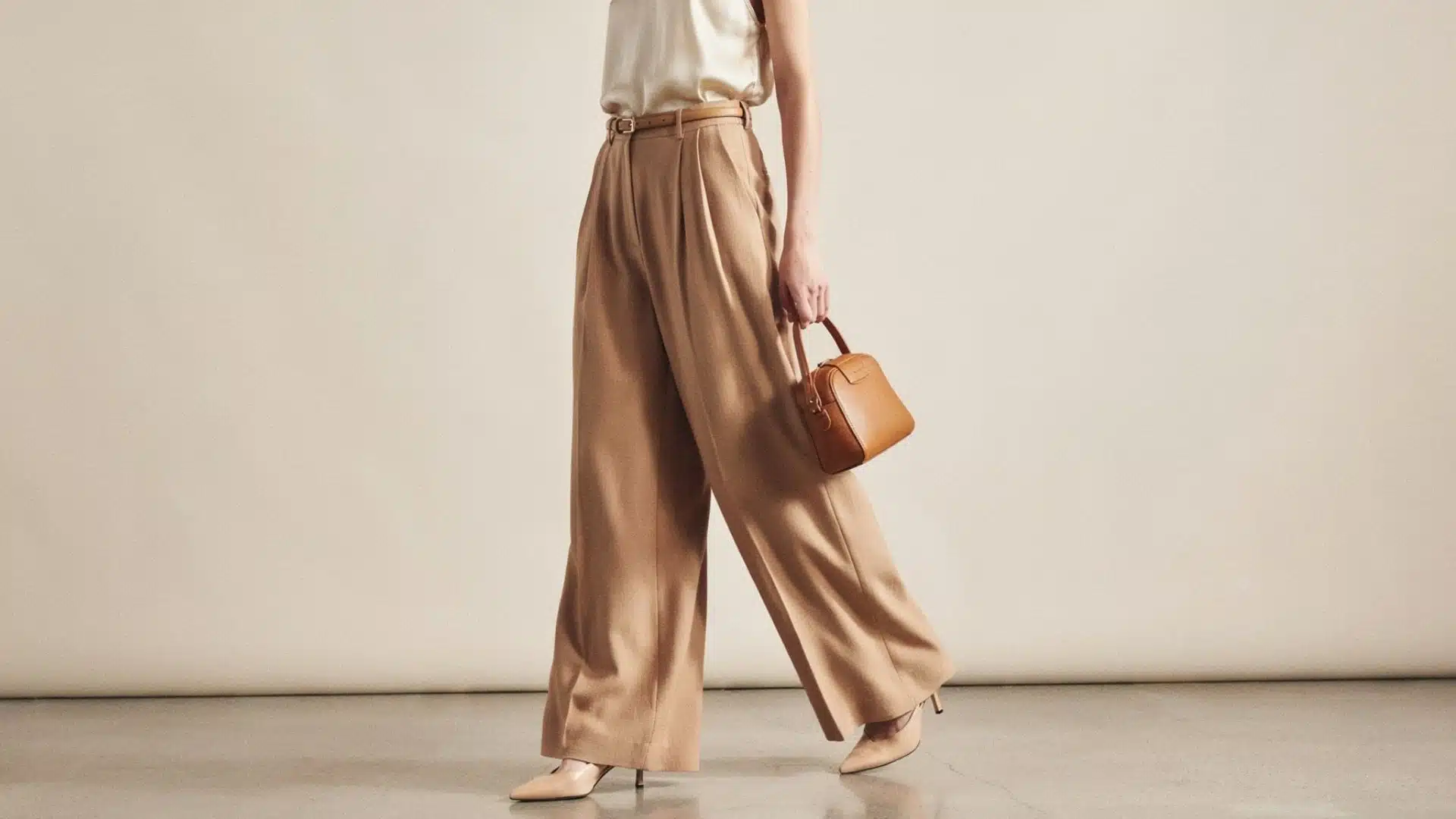 Person wearing stylish wide-leg trousers with a relaxed fit and modern outfit showcasing a comfortable fashion look.
