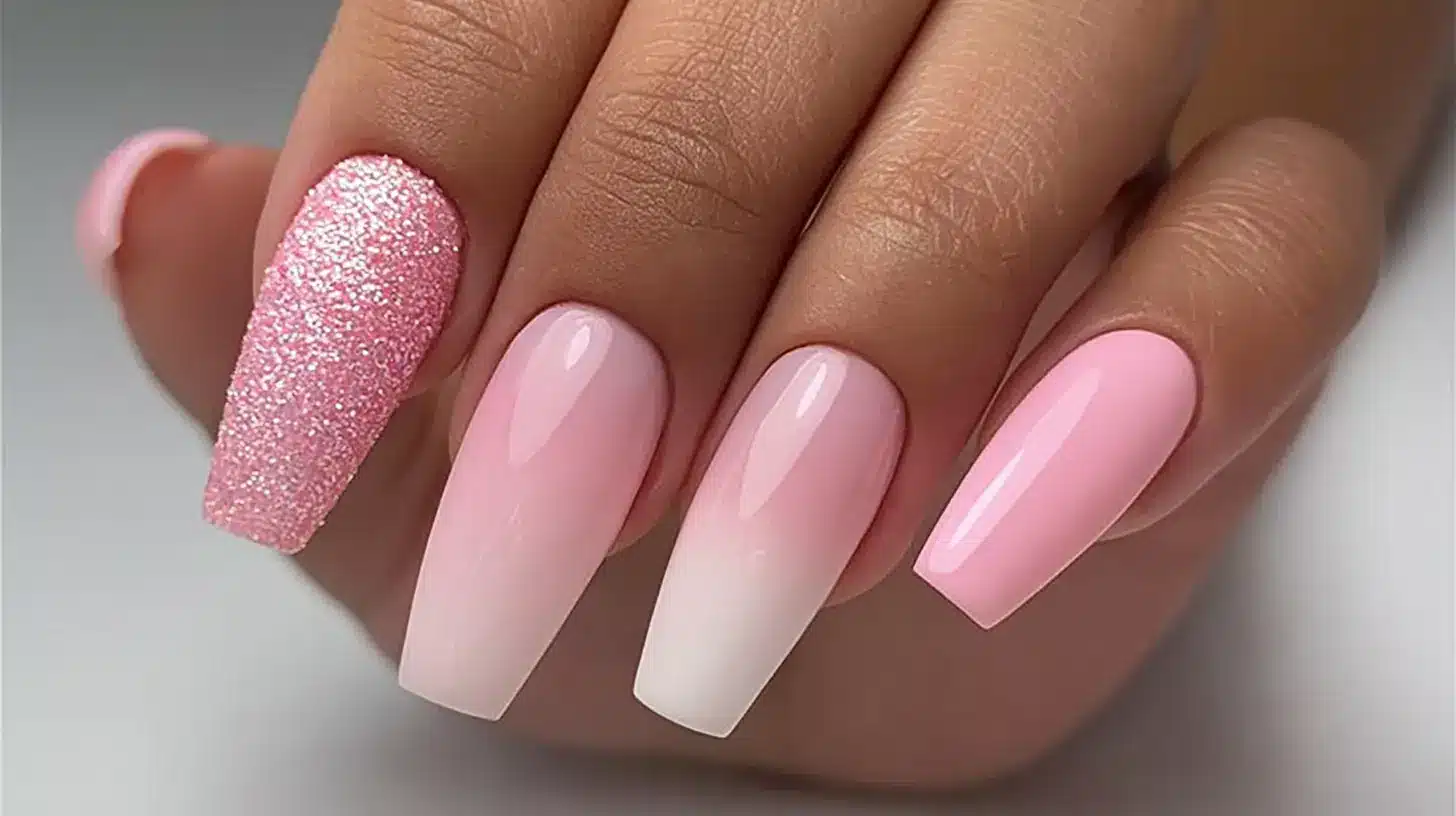 Coffin nails with pink to white ombre and a chunky pink glitter accent nail.
