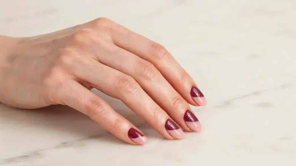 Color block nail design featuring contrasting shades split across glossy nails for a modern simple nail art look