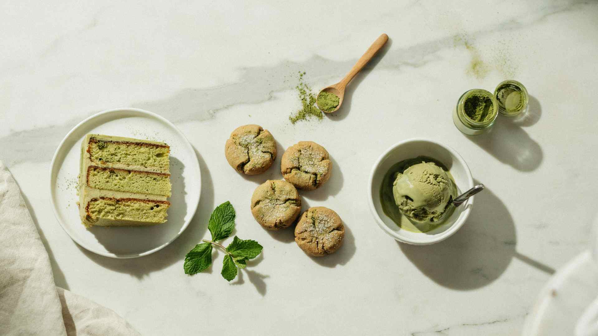 Matcha cake, cookies, and ice cream dusted with matcha powder