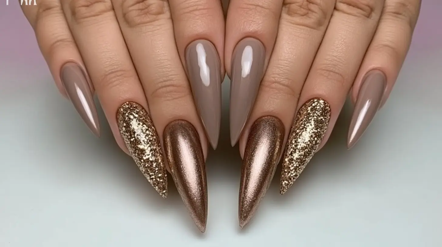 Stiletto nails mixing taupe, metallic bronze, and gold glitter shades.